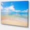 Designart - Large Clouds Over Calm Beach - Seashore Photo Canvas Print